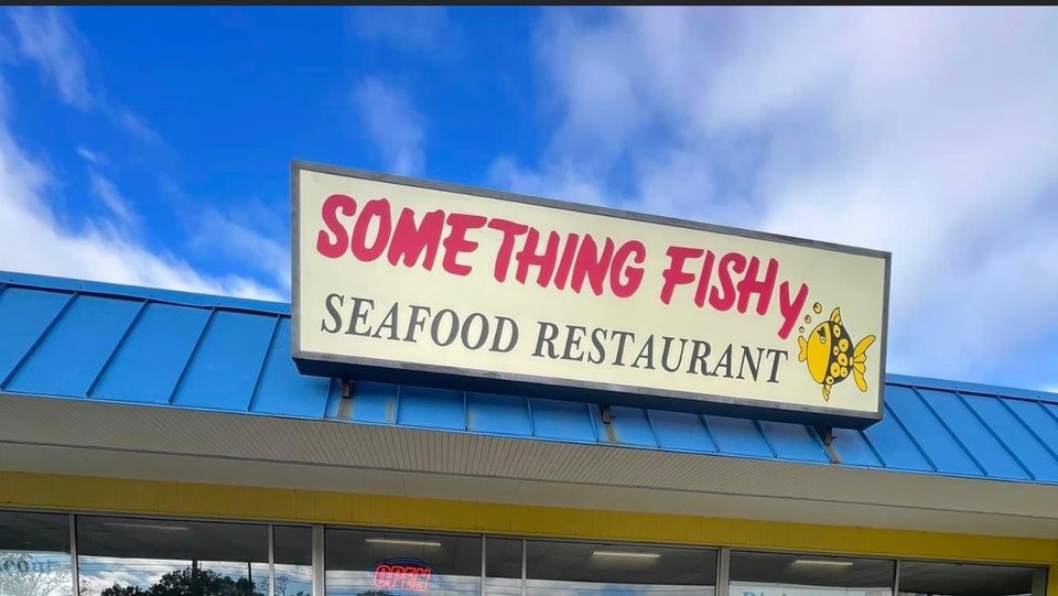 Fried seafood platters on a casual table.