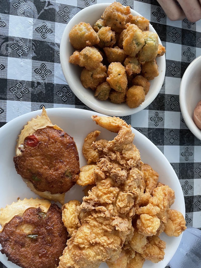 Clam chowder and fried shrimp served together.